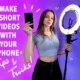 Yugoro standing with a camera light and a phone with the text "make short videos with your phone, tips and tricks"