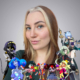 Picture of Nola Klopp, surrounded with multiple characters she has voiced