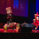Karrichaos on stage performing a cosplay skit